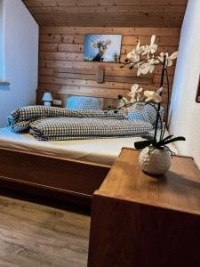 a bedroom with a large bed with a wooden wall at Casa Gomes in Gaschurn