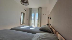 A bed or beds in a room at Sierra Nevada Gala Bike CAR