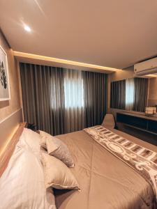 Una cama o camas en una habitación de Apto conforto extremo no melhor do Centro de CWB