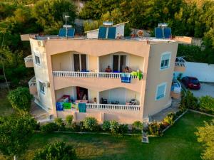an aerial view of a house with a balcony at OniRana Apartments in Borsh