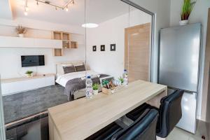 a bedroom with a bed and a desk in a room at 21 Residence Studio in Bucharest