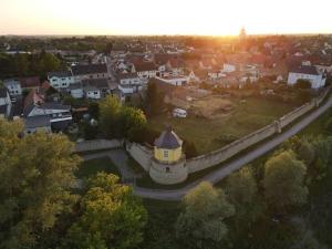 an aerial view of a town with a yellow house at Ferienwohnung Bördeblick in Barby