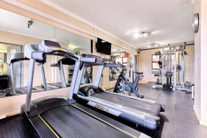 a gym with two tread machines and a treadmill at Glammys @77 Grayston Drive in Johannesburg