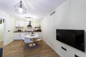 Kuchyň nebo kuchyňský kout v ubytování Apartamentos San Lazaro