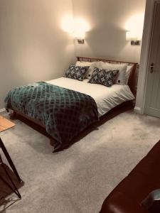 a bedroom with a large bed in a room at Hideaway between Coast and Moors in a beautiful Village apartment in Sleights