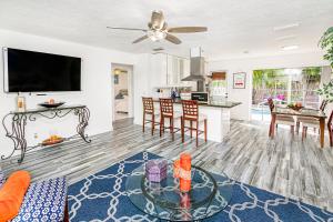 a living room with a couch and a table at Gorgeous home, backyard and pool in Boynton Beach in Boynton Beach