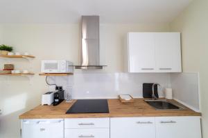 Kuchyň nebo kuchyňský kout v ubytování Apartamentos San Lazaro