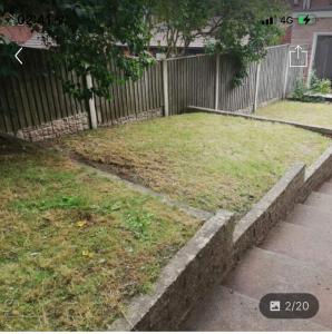 a yard with a fence and some grass and a sidewalk at Bramcote 3 bedroom house in Bramcote