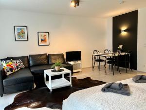 TV a/nebo společenská místnost v ubytování Jutta Deluxe Apartment #301