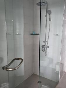 a shower with a glass door in a bathroom at Andaman sea view private in Patong Beach