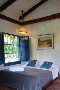 a bedroom with two beds and a window at Casa Benigno muy cerca de Ginebra in Ginebra