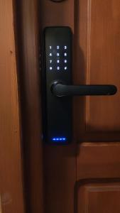 a close up of a remote control on a door at Studio, Kraków - Czyżyny in Kraków