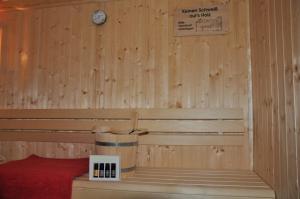 a room with a sauna with a clock on the wall at Ferienhaus direkt am Diemelsee-Heringhausen-Willingen-Toplage-Sauna-3 Schlafzimmer-2 Terrassen-109 qm-incl Wäsche in Diemelsee