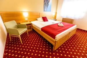 Postelja oz. postelje v sobi nastanitve Hotel Bau Maribor