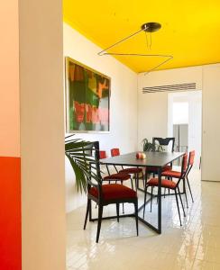 a dining room with a table and chairs at B&B Toledo Panoramic Rooftop with terrace in Naples