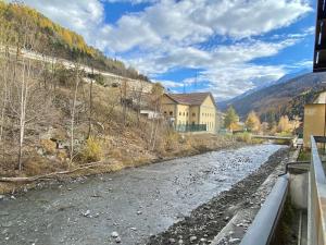 a house on the side of a road next to a river at SARA'S in Bardonecchia