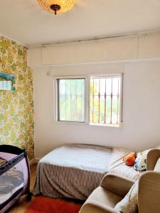 a bedroom with a bed and a window at Bella Vista House in Chiva