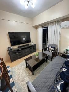 TV at/o entertainment center sa Cozy 2 Bedroom Condo with Balcony for Rent