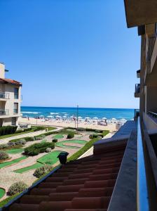 a view of the beach from the balcony of a building at Urlaub - Obzor Beach Resort A109 in Obzor