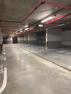 an empty parking lot in an empty parking garage at Woodside Duplex Apartment Ski in Ski out with garage in Kopaonik