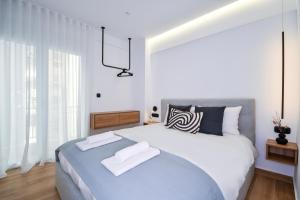 Postel nebo postele na pokoji v ubytování Luxury Downtown Apartment C2