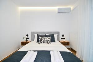 Postel nebo postele na pokoji v ubytování Luxury Downtown Apartment C2