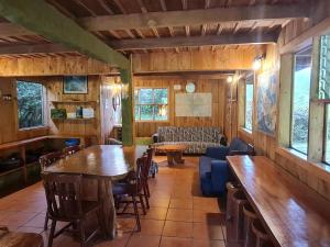 a living room with a table and a couch at Finca Terra Viva in Monteverde Costa Rica