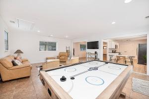a large living room with a large ping pong table at House of Kaktos located in Central Wilmington. Sleeps 8 in Wilmington