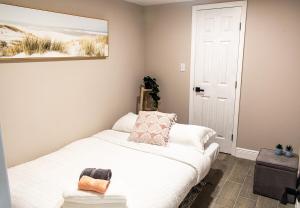 a bedroom with a white bed and a white door at Boho Chic Cosy Home In The Heart Of Tampa And Ybor in Tampa