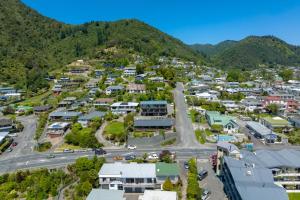 an aerial view of a small town with mountains at Harbour View Motel in Picton