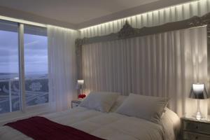Cama ou camas em um quarto em Yoo Punta del Este - Rental Club Apartments