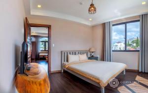 Postel nebo postele na pokoji v ubytování Guava Hill Boutique Hotel