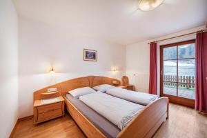 Postel nebo postele na pokoji v ubytování Rieglhof Apartment Maisel