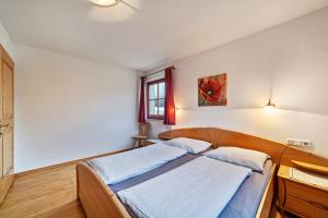 Postel nebo postele na pokoji v ubytování Rieglhof Apartment Maisel