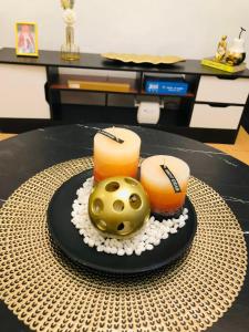 een tafel met een taart met een gouden bal erop bij Avida Tower Sucat, comfortable studio type in Manilla