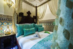 Postel nebo postele na pokoji v ubytování Riad Rcif & Spa Originale