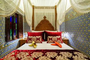 Postel nebo postele na pokoji v ubytování Riad Rcif & Spa Originale