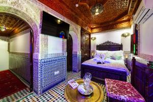 Postel nebo postele na pokoji v ubytování Riad Rcif & Spa Originale