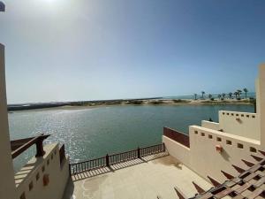a view of a body of water from a building at Cove private one bedroom lagoon villa in Ras al Khaimah
