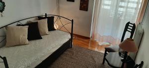 A bed or beds in a room at Koukaki View