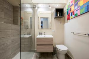 a bathroom with a toilet and a sink and a shower at Casa Ameliotta Design in Rome