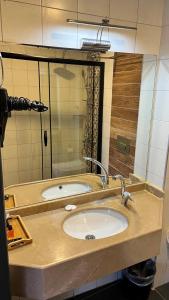 a bathroom counter with a sink and a mirror at Nomade Old City Hotel in Istanbul