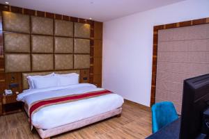 Postel nebo postele na pokoji v ubytování Asian Buddha Hotel + 37 fotografií