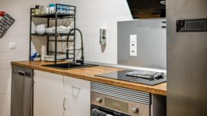 a kitchen with a counter with a stove top oven at Ground Floor Apartment with Three Bed on La Torre Golf - AO1402 in Torre-Pacheco