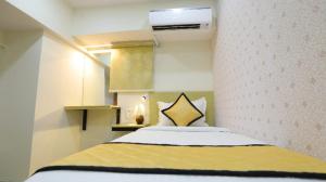 a bedroom with a bed in a room at GRACE RESIDENCY in Chennai
