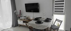 Un televizor și/sau centru de divertisment la Divcibare As apartmani