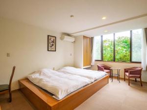 Una cama o camas en una habitación de HAKONE GORA ONSEN Hotel Kasansui 37 fotos más