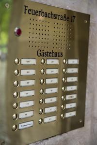 a close up of a metal remote control panel at Apartmenthaus Feuerbach in Leipzig