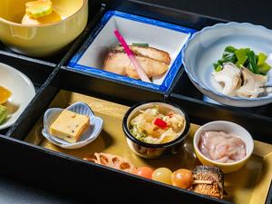 a box filled with different types of food at HAKONE GORA ONSEN Hotel Kasansui in Hakone