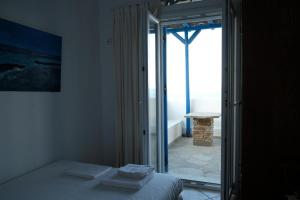 A bed or beds in a room at Beach House in Tinos island